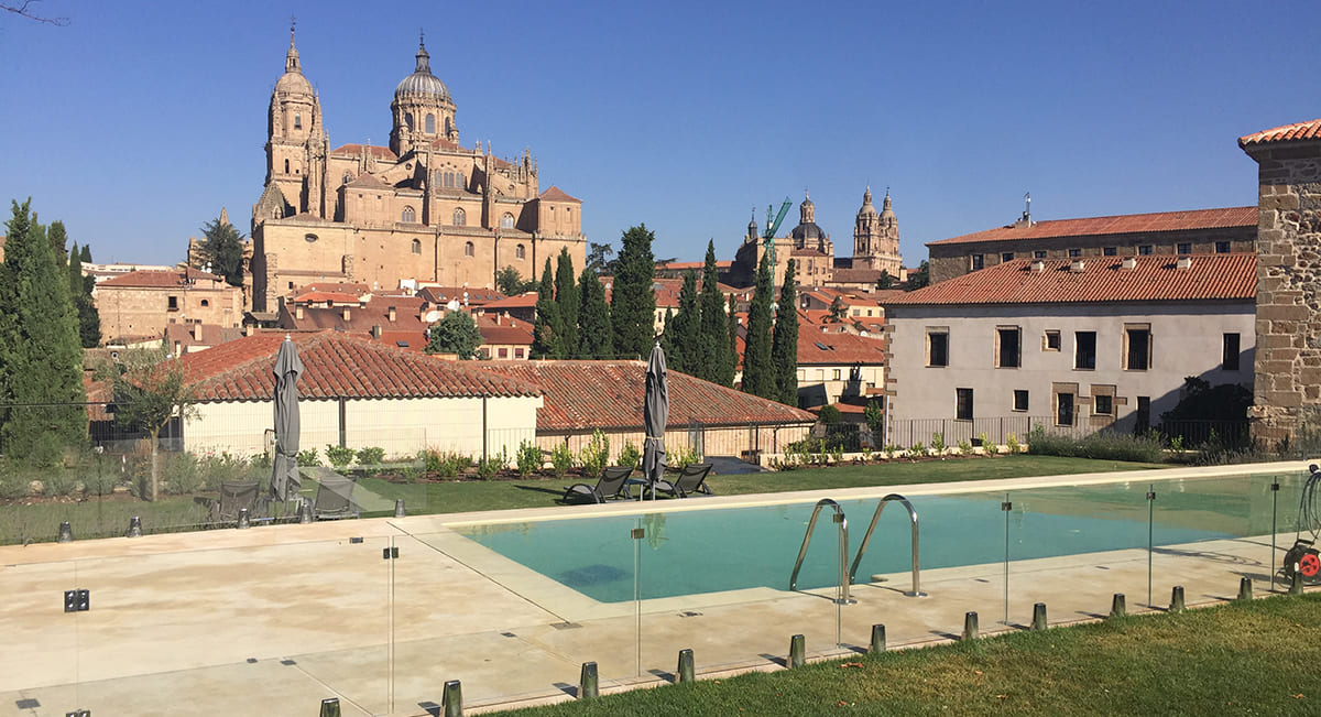 Outdoor pool with views over Salamanca cathedral